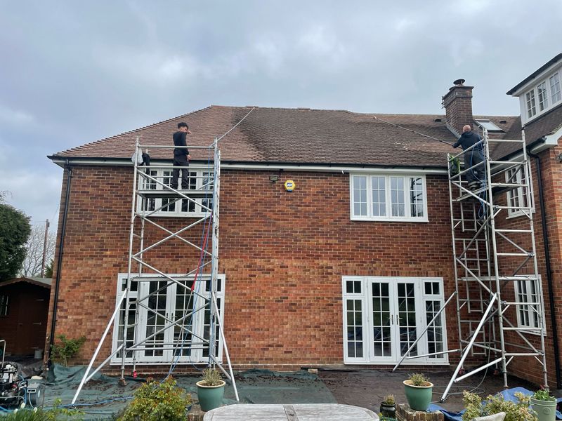 Roof cleaning carried out safely from scaffold towers by The Roof Moss Cleaners in Westbury